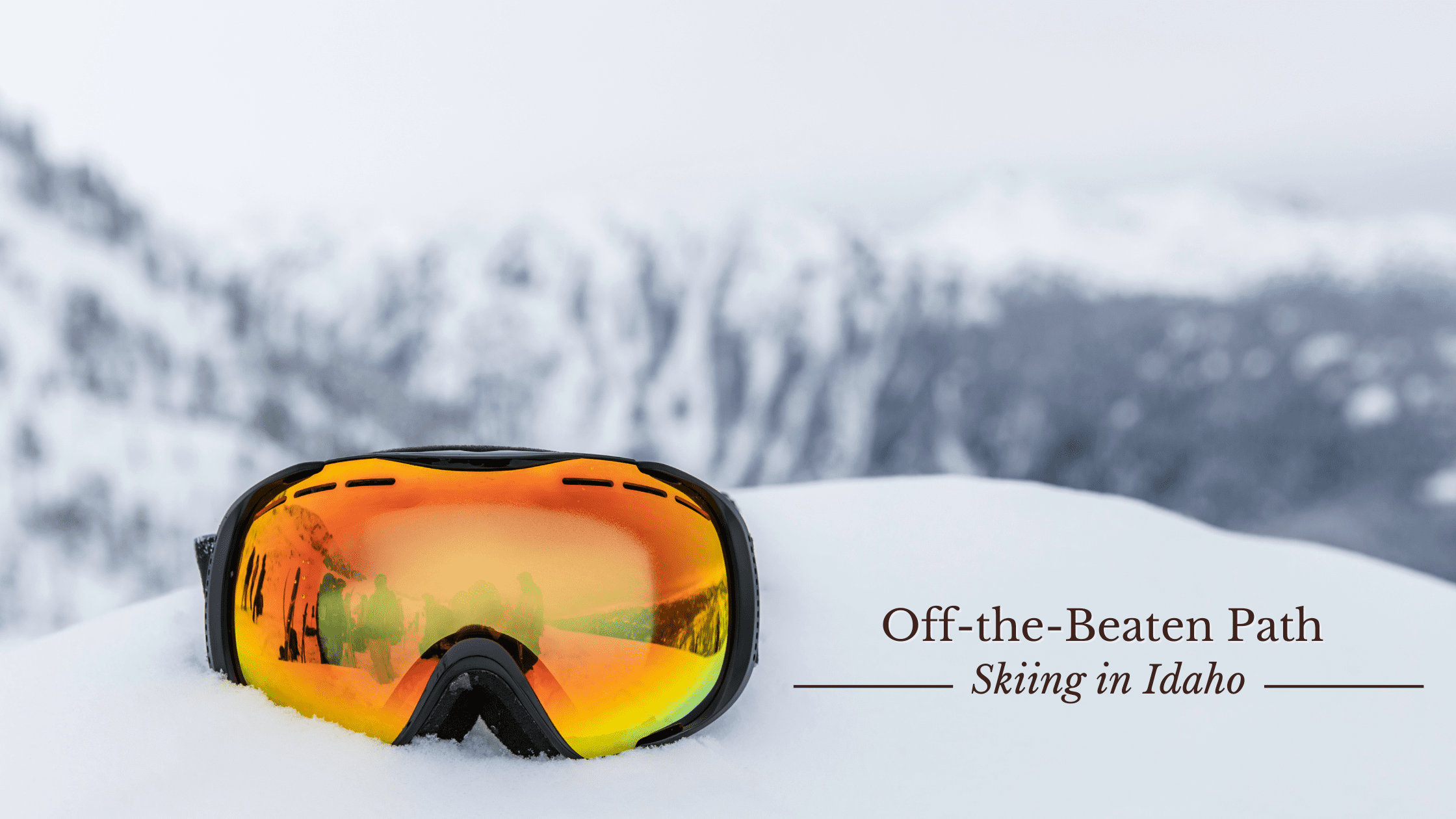 Image of ski goggles on top of ski mountain