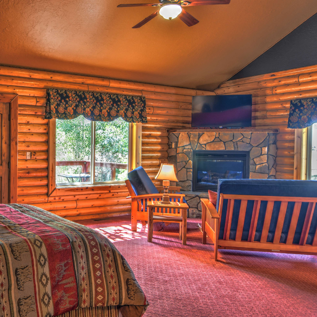 image of queen bed and oversized suite with gas fireplace at River Retreat Lodge in Swan Valley Idaho