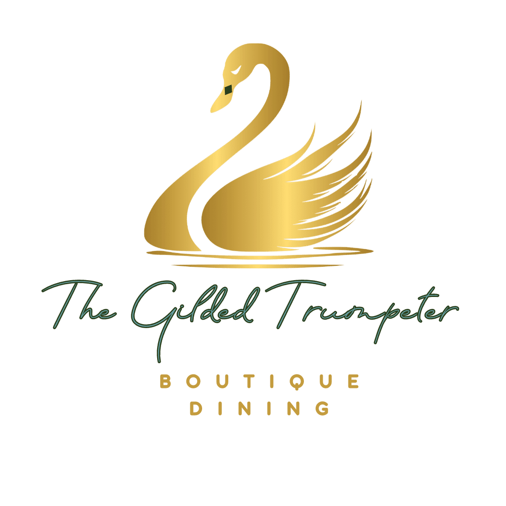 image of guilded trumpeter logo - the restaurant at River Retreat lodge